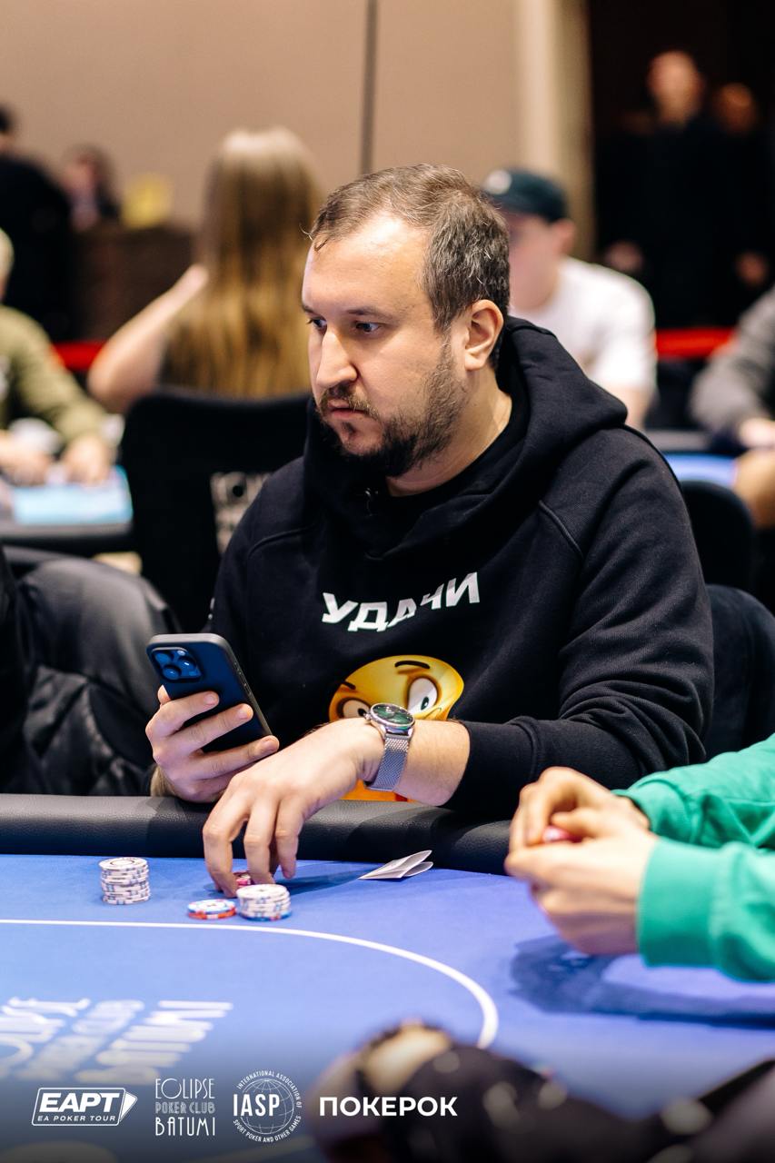 EAPT Batumi player using a phone at the table
